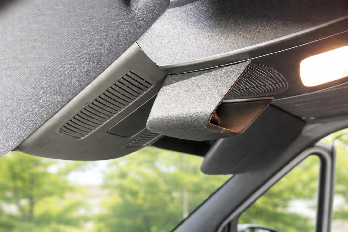OEM-style overhead glasses holder installed in a Mercedes Sprinter interior